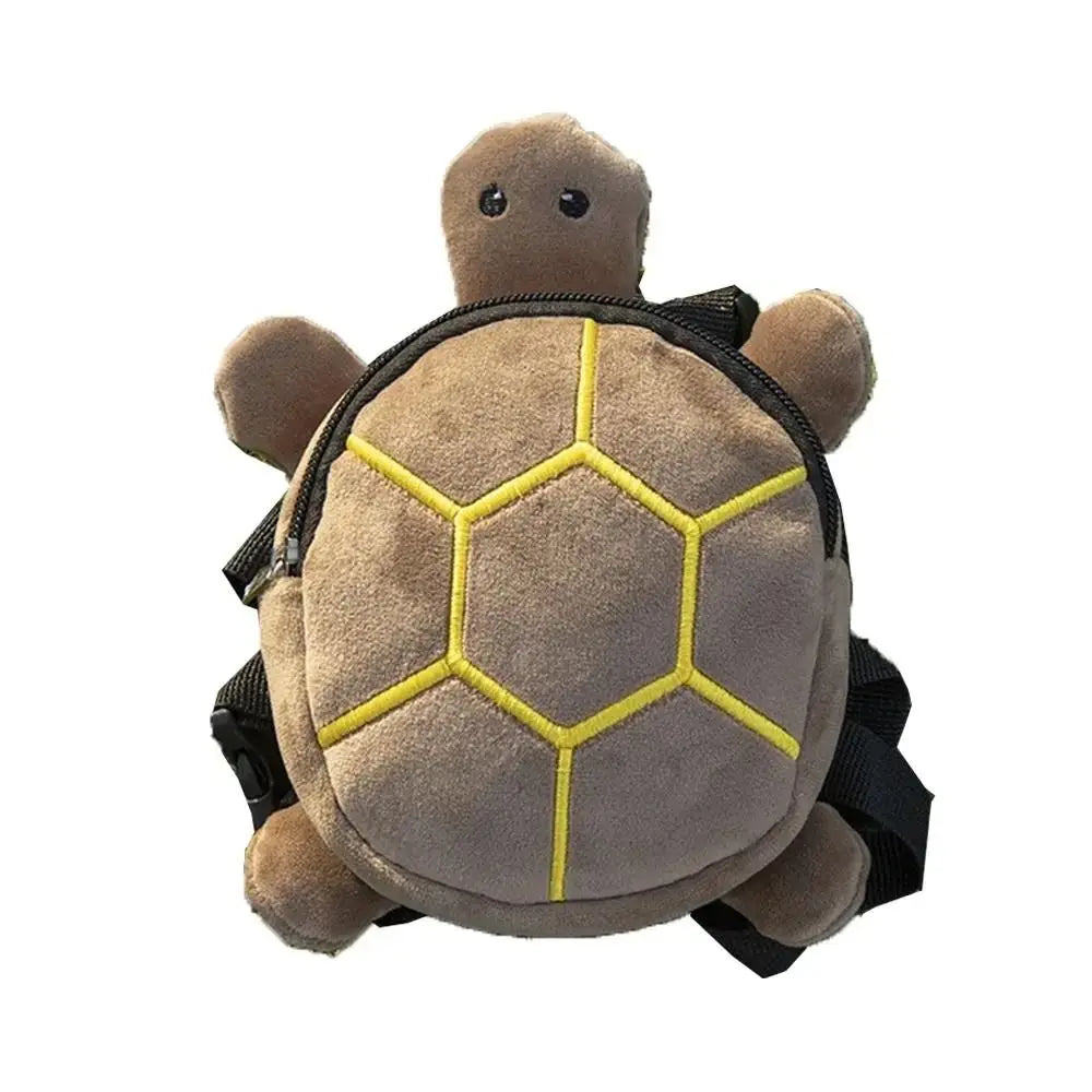 a plush brown turtle shape dog backpack with yellow stitching on its shell and black straps designed as a pet carrier