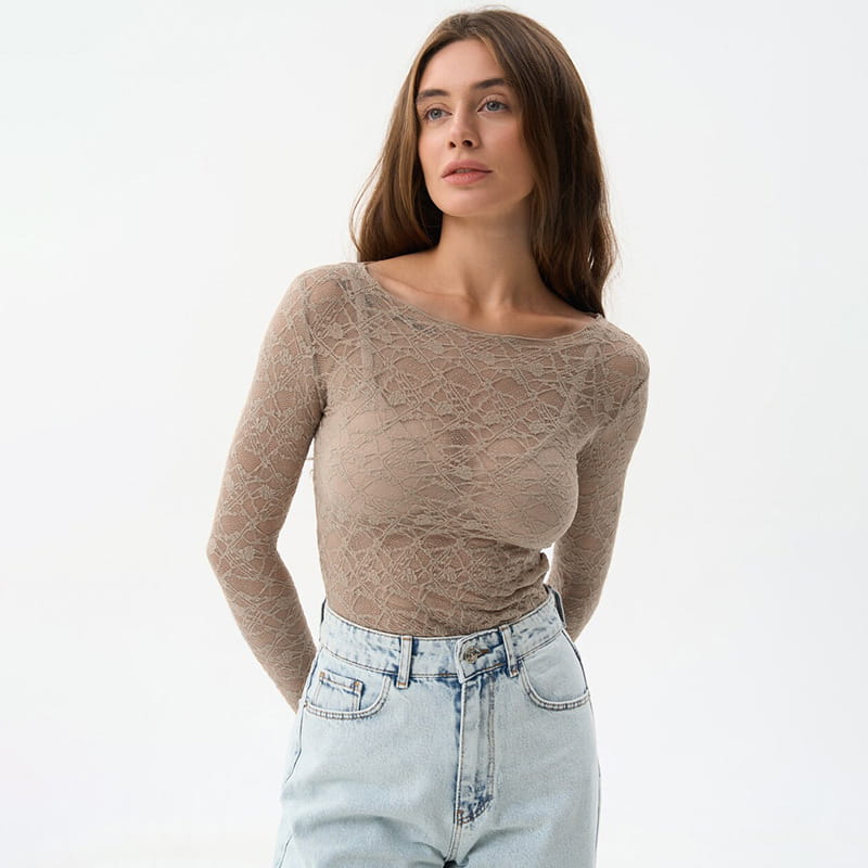 A beige long-sleeved lace crop top with a boat neckline designed for women aesthetic clothes and aesthetic wear.
