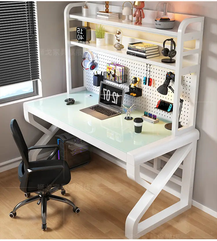 White modern office desk with a glass top and integrated storage shelves designed for a contemporary workspace.