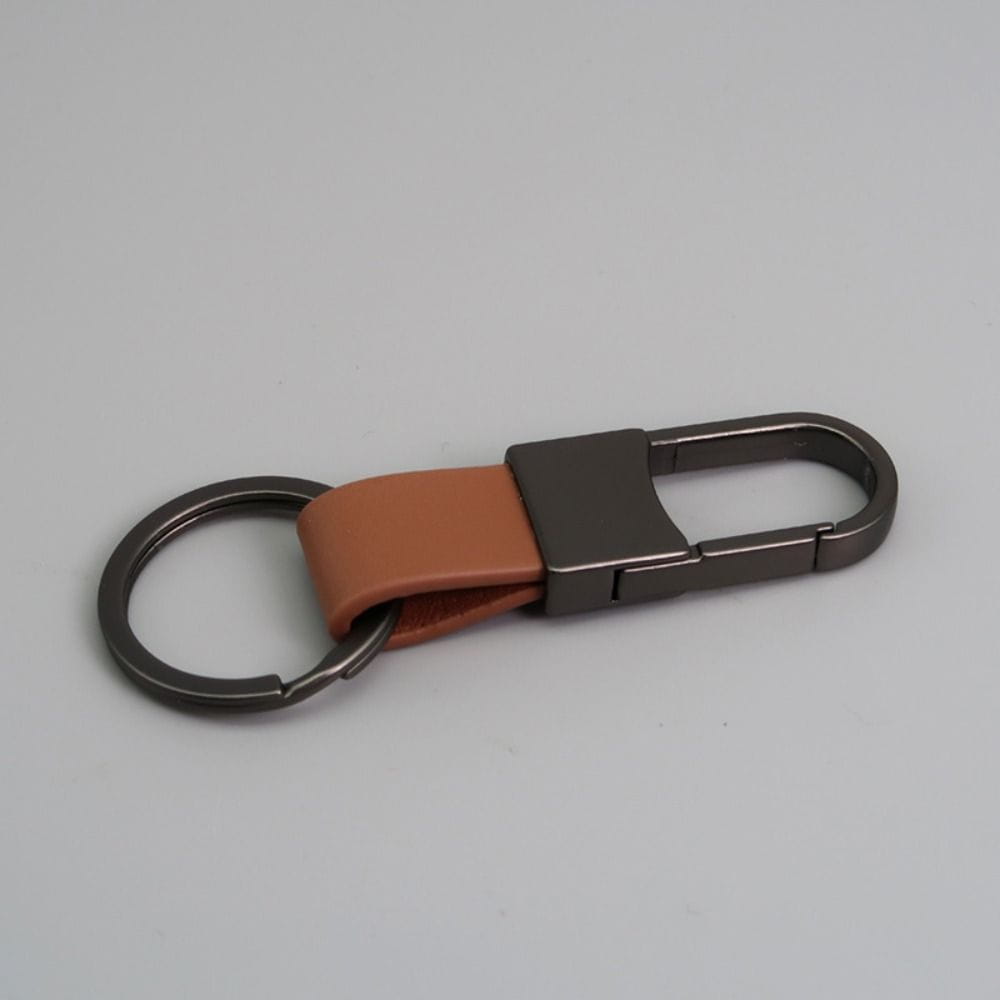 Brown leather keychain with a matte black metal carabiner and split ring designed as an anti lost waist ring.