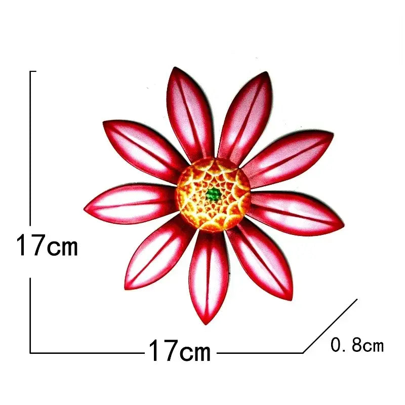 Metal flower wall art sculpture featuring a vibrant red 17cm wide metal flower with a detailed golden center and green accent.