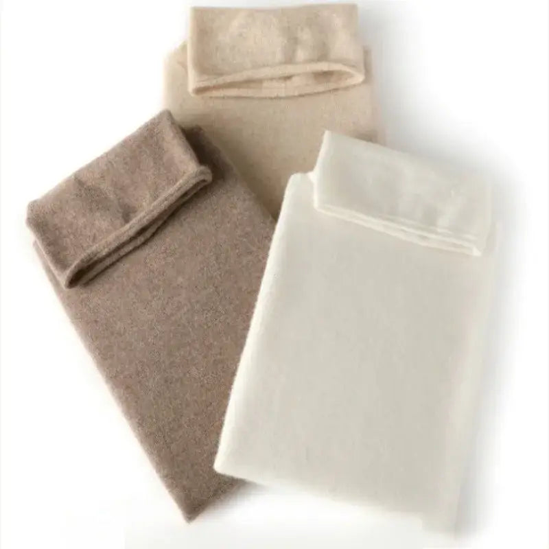 three folded merino wool turtleneck vests for women in beige taupe and off-white slim knit base layer sweaters made of cashmere