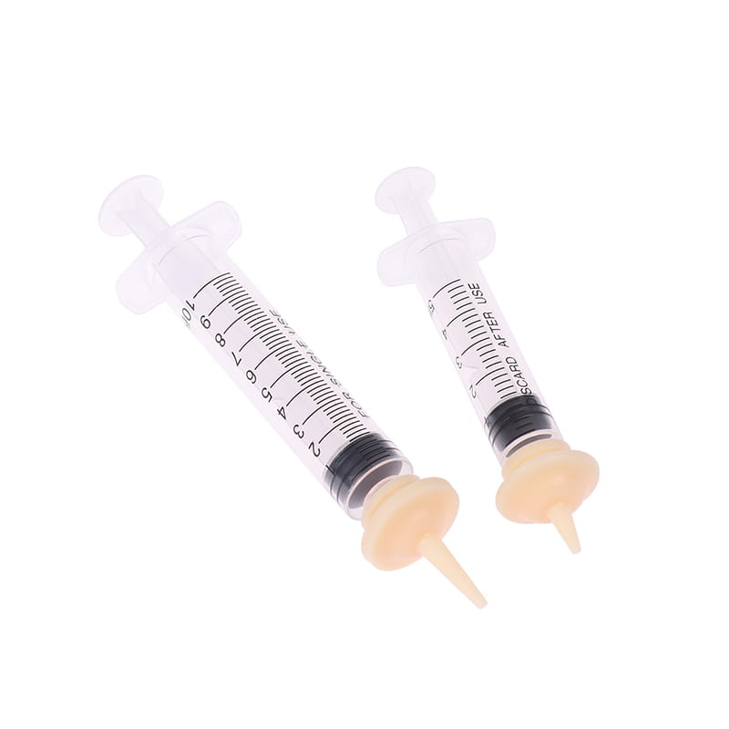 two transparent plastic oral syringes with black measurement markings and beige rubber tips in sizes 1ml and 3ml for pet feeding with silicone nipple feeders