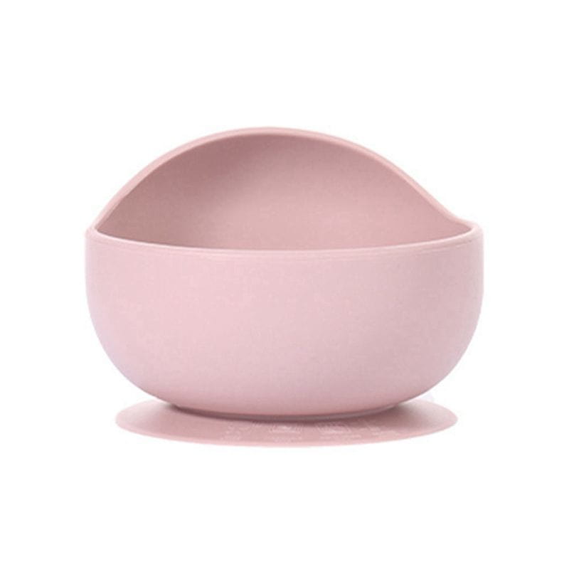 A soft pink silicone baby feeding bowl with a suction base designed for secure mealtime use.