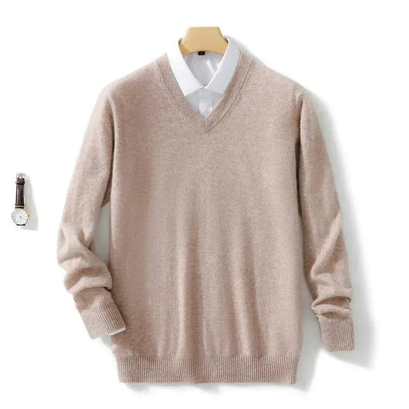 Beige men cashmere v neck pullover sweater with ribbed cuffs and hem displayed over a white collared shirt.