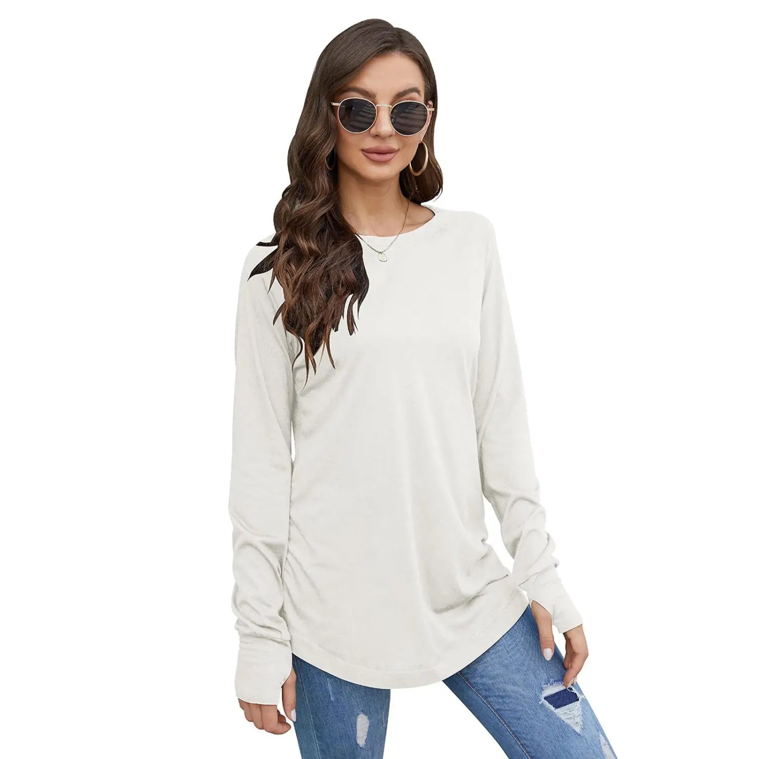 Cream-colored women long sleeve cotton tunic top with a relaxed fit and rounded neckline featuring a solid pattern type.
