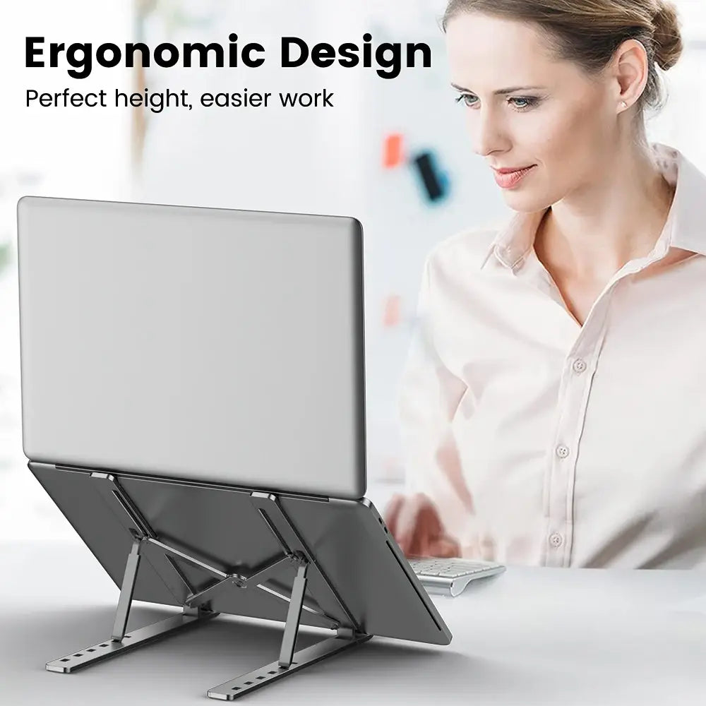 Silver metallic adjustable aluminum laptop stand with ergonomic holder featuring adjustable legs and a sleek minimalist design.