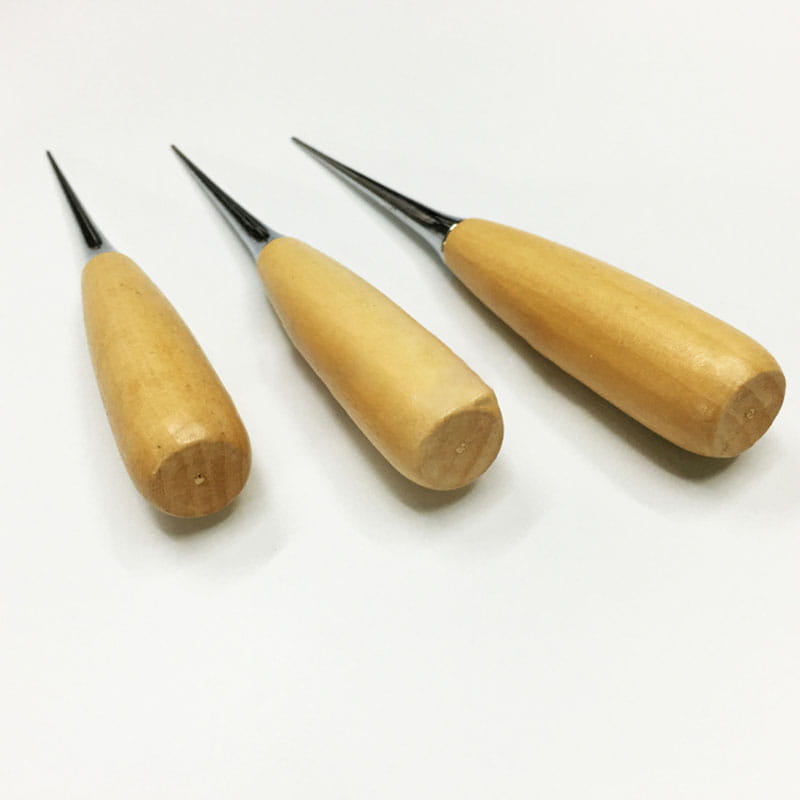 Three wooden-handled leather sewing awls with slender pointed metal tips for craft punching and stitching.