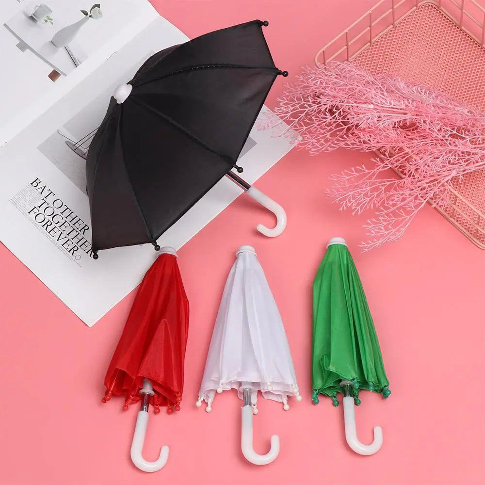 black mini doll umbrella with a white curved handle and matching white tips on the ribs designed as bjd accessories