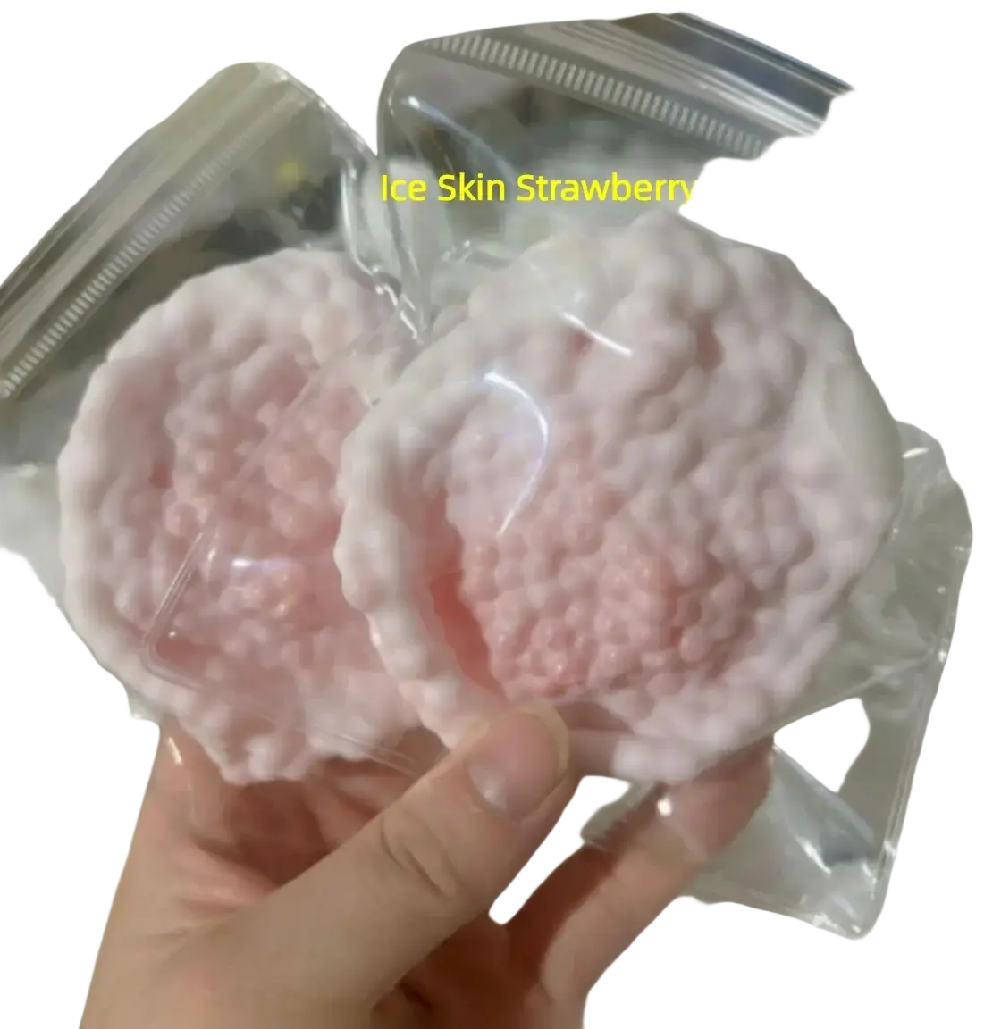 Front view of pink textured ice skin strawberry candies in clear packaging for the 2026 snow skin sea salt squishy toy