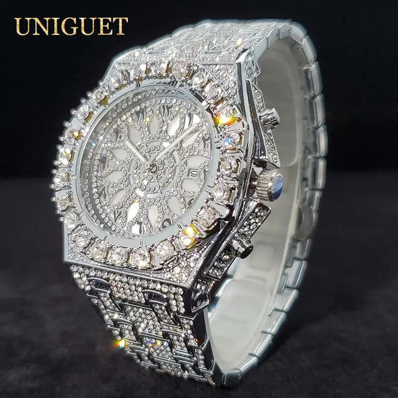 A dazzling silver diamond-encrusted iced diamond men’s quartz watch with a bold intricate design and a branded uniguet logo luxury silver hip hop timepiece.