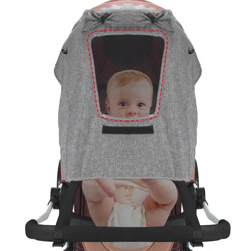 Graues, strukturiertes Universalkinderwagen-Sonnensegel aus UV-schutzierendem Stoff mit Klarsichtfenster und von der Rückseite sichtbaren roten Ziernähten
