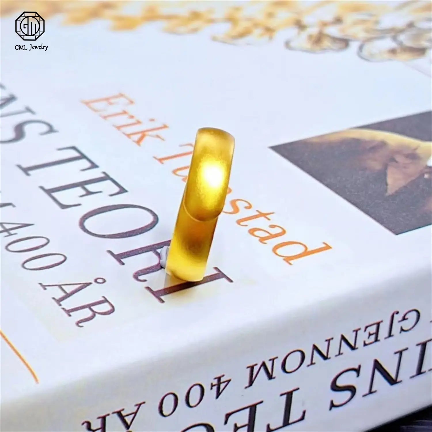 A sleek solid gold-colored sand gold adjustable ring with a smooth polished surface and fade resistant matte wide band unisex design.