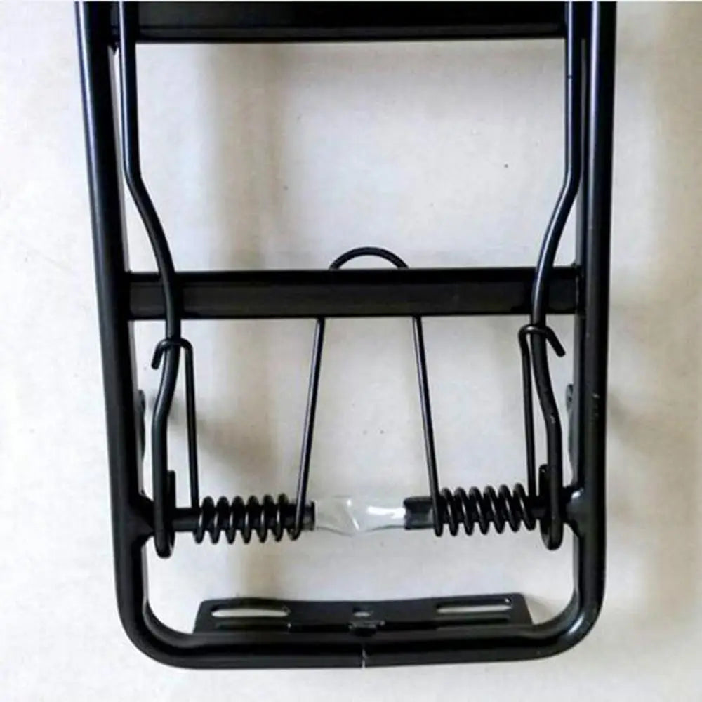 black metal humane trap with spring-loaded mechanism and adjustable release bar shown from the back side