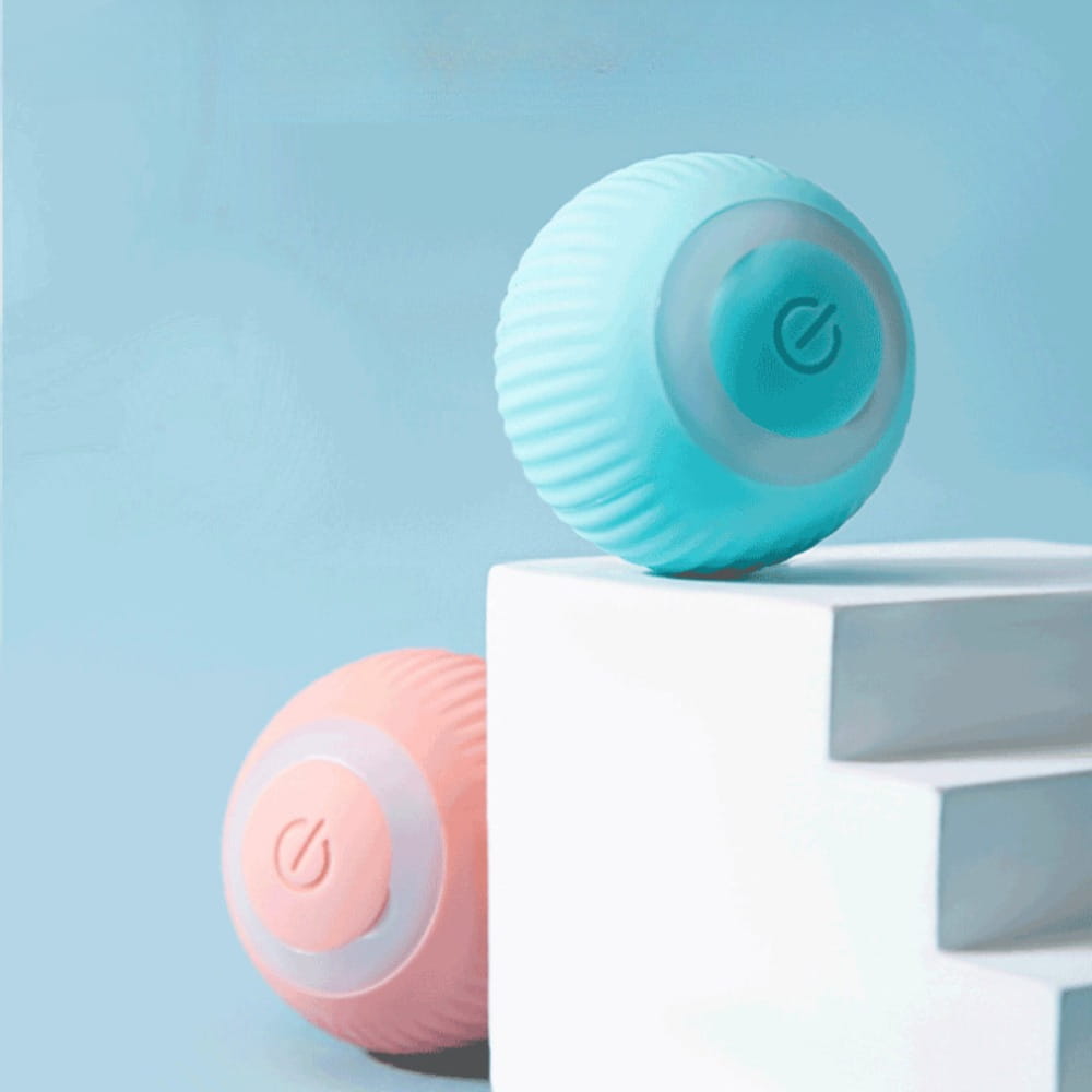 an automatic interactive smart cat ball toy made of soft pastel blue and pink silicone with a ribbed exterior and a circular power button on the top surface