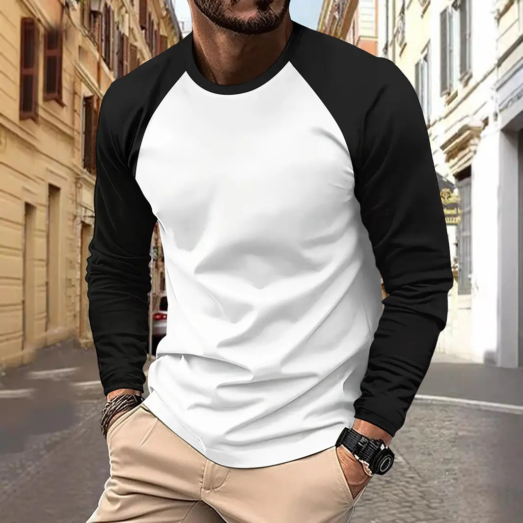 Chemise à manches raglan longues noir et blanc, confectionnée dans un tissu doux, conçue comme un haut de printemps décontracté pour homme.