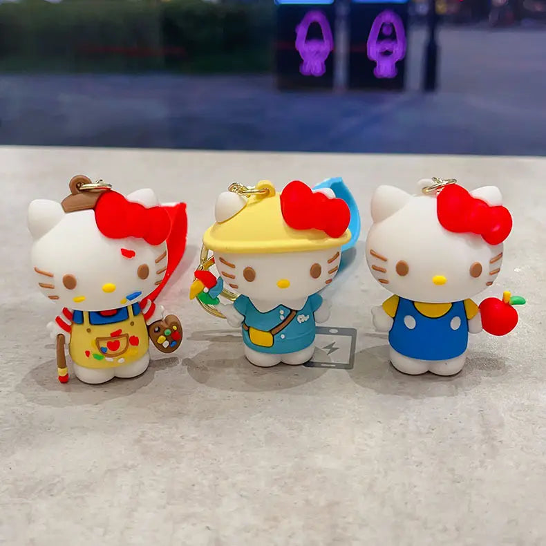 Three hello kitty cartoon keychain anime bag charms featuring distinct colorful outfits and accessories made of durable materials for decorative use.
