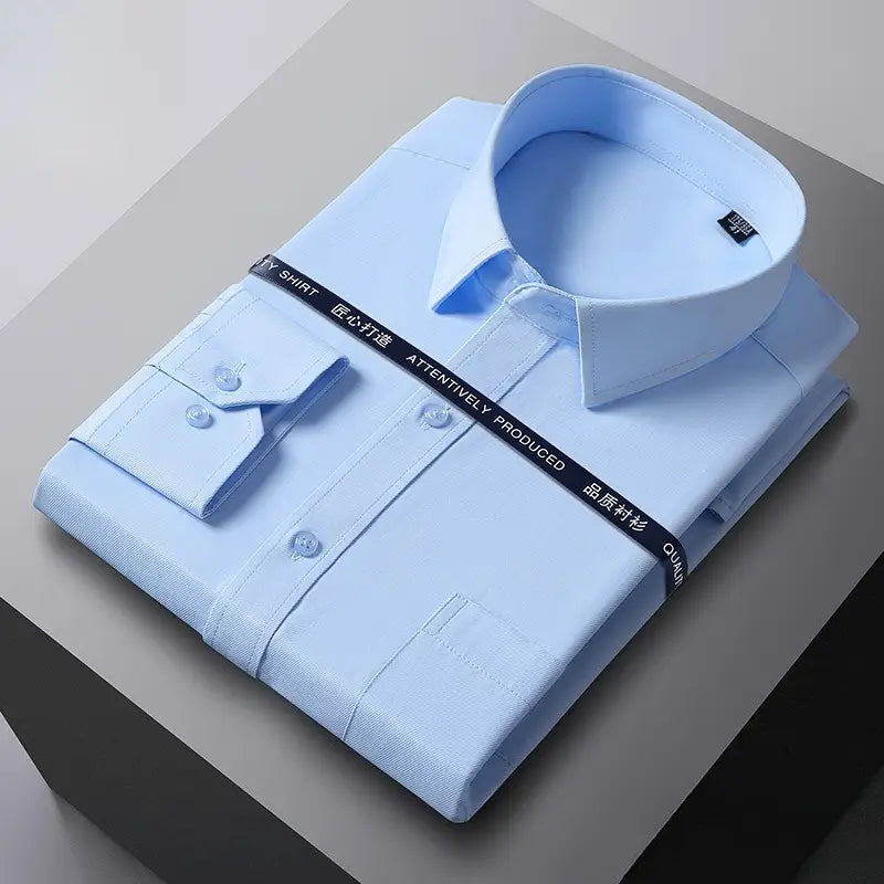 A neatly folded light blue men long sleeve dress shirt with a classic collar and buttoned cuffs wrapped by a black ribbon, made from anti-wrinkle material suitable for formal office wear.