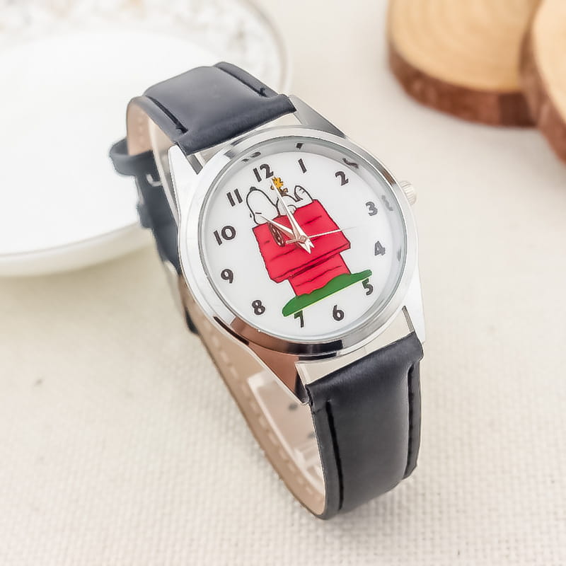 Black leather strap Snoopy quartz watch with a white face featuring Snoopy in his red doghouse cartoon design
