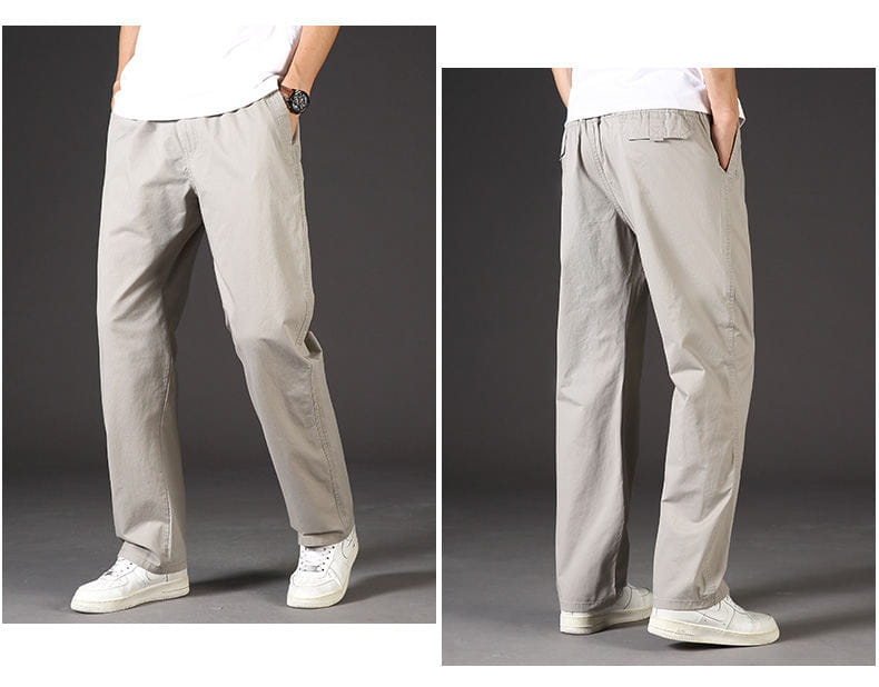 Light gray cotton men cargo pants with relaxed fit and side pockets designed as utility trousers.