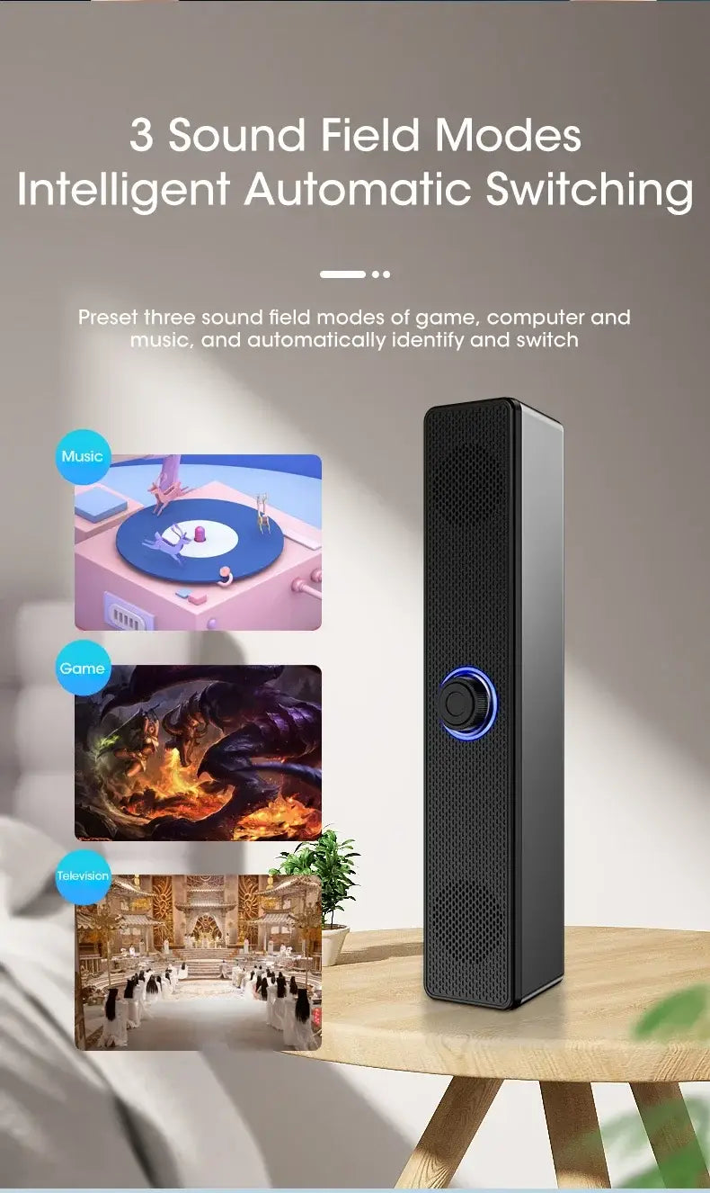 Black rectangular Bluetooth computer speaker with a circular blue-lit control button and perforated grille design for wireless desktop soundbar use