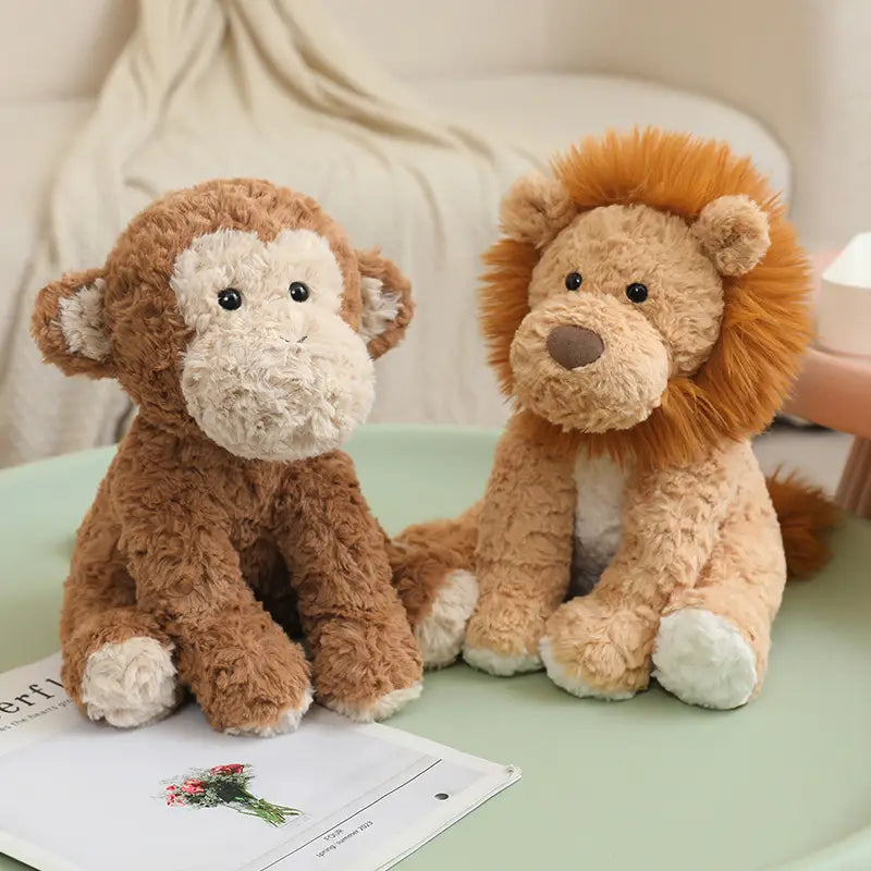 Soft brown and cream plush stuffed animal toy monkey with fluffy fur, black button eyes, and white paw pads measuring 25cm.