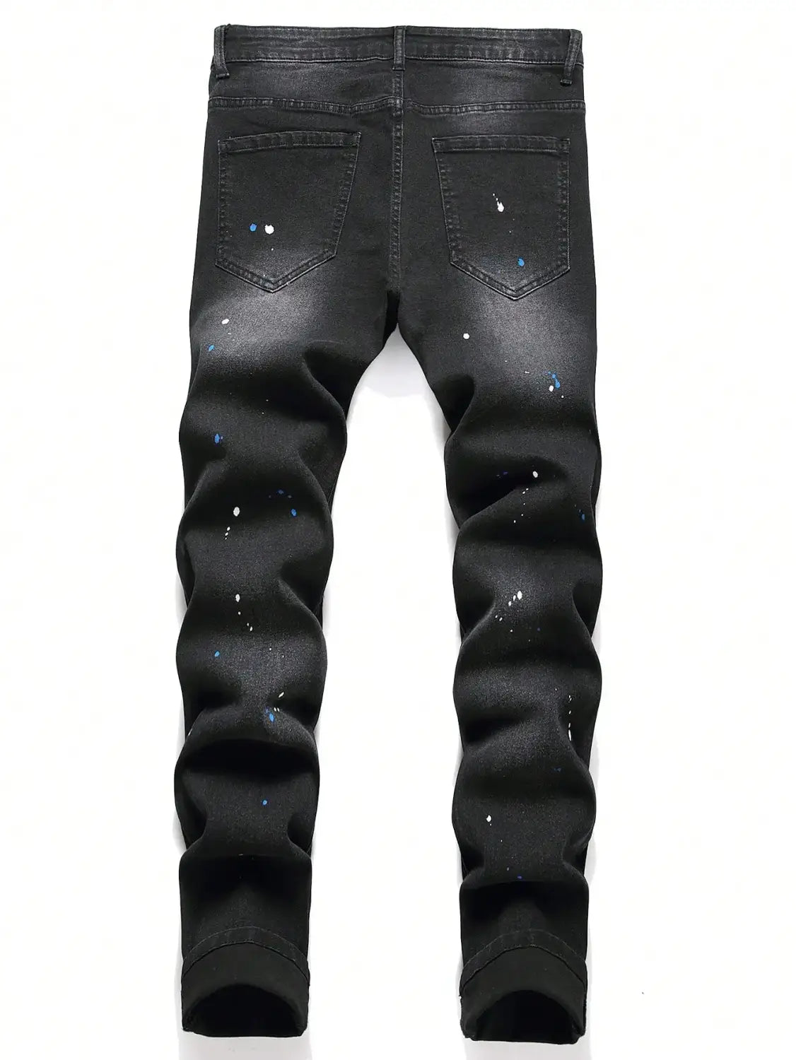 Jeans denim skinny extensibles déchirés Y2K pour hommes en noir, au tombé ajusté, avec des accents discrets d’éclaboussures de peinture bleu et blanc.
