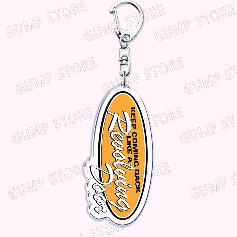 Silver oval Tate Mcrae acrylic keychain features a vibrant orange center with white cursive text keep coming back and revolutionary designed as a music fan gift.