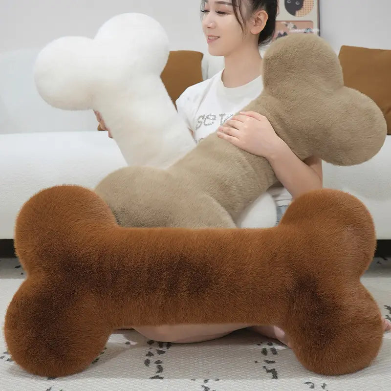 a rich brown kawaii bone shape plush pillow with a soft and fuzzy texture designed as a cozy nap cushion