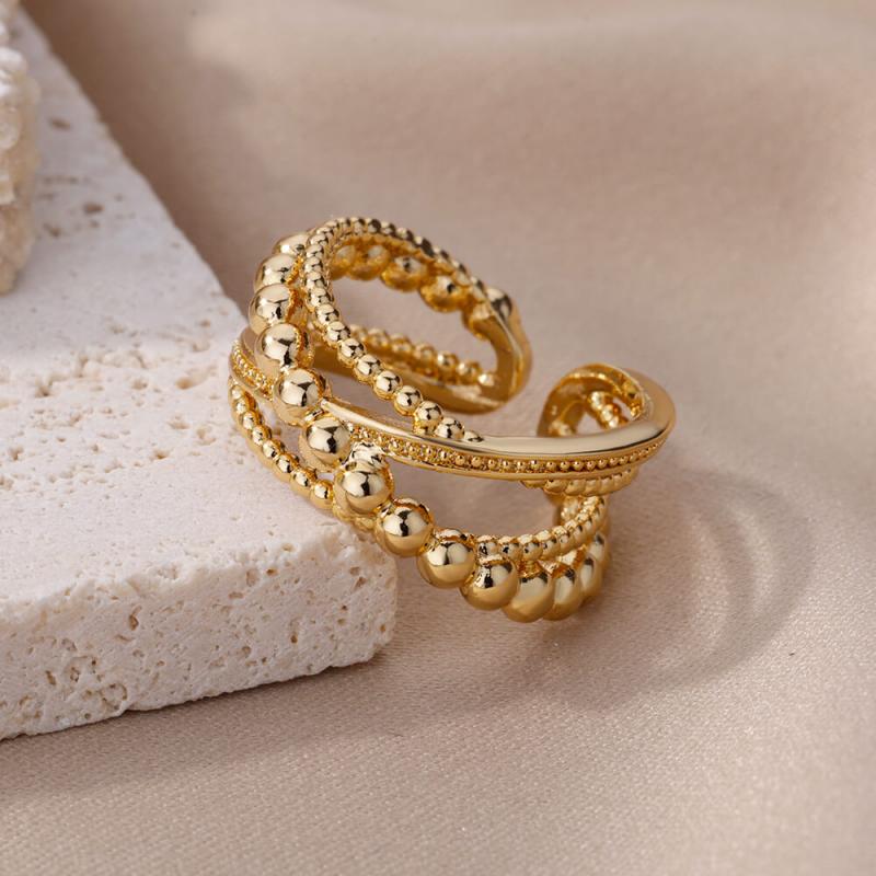 Gold color stainless steel rings for women featuring a vintage wedding jewelry design with multi-layered beaded and textured bands.