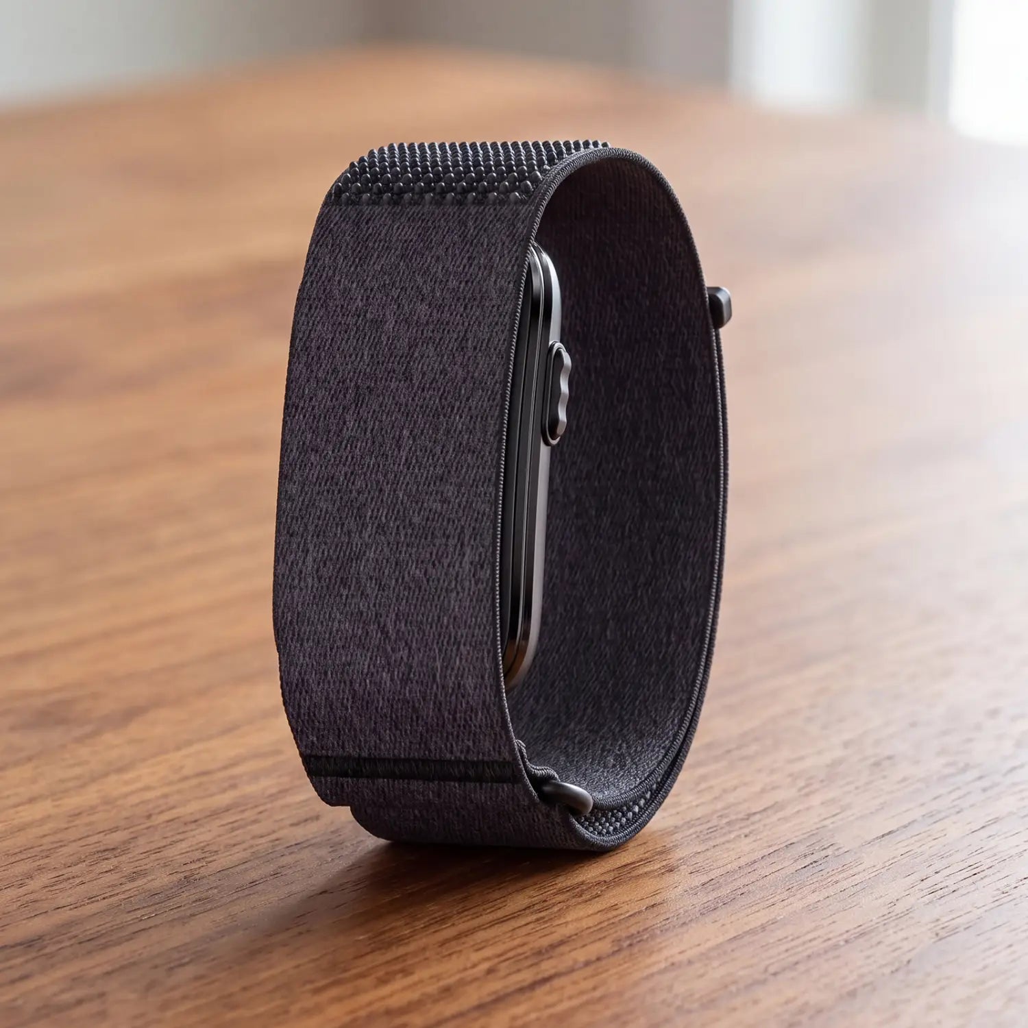 Black breathable replacement strap for Cirqa smart band made of woven nylon with a textured elastic design and metallic clasp for an adjustable sport watch.