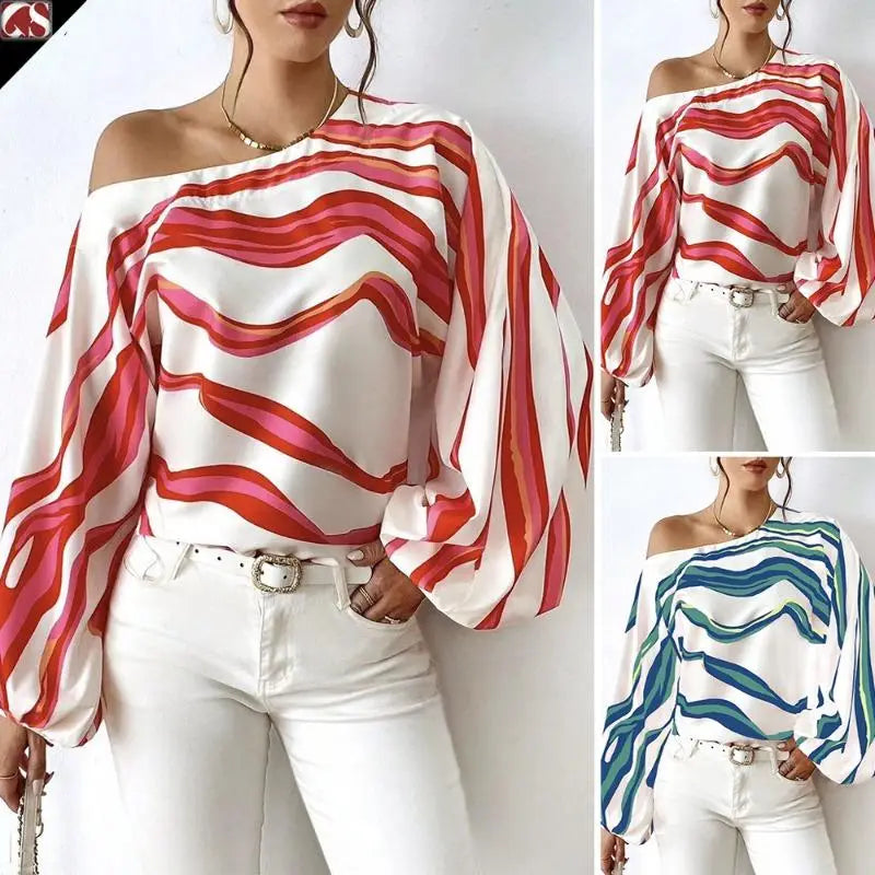 Slash neck off shoulder satin blouse with flowing wide sleeve style featuring a vibrant wavy stripe pattern in reds and pinks on white fabric.