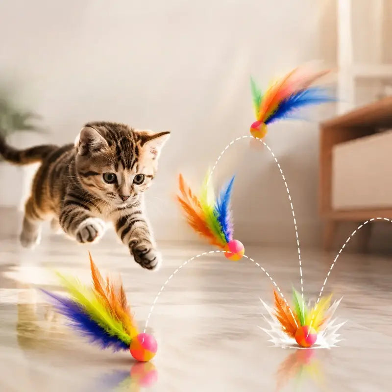 jouet à balle interactive pour chats comprenant des plumes colorées en forme de arc-en-ciel et une base de balle ronde et souple, comme type de jouet à balle dynamique.