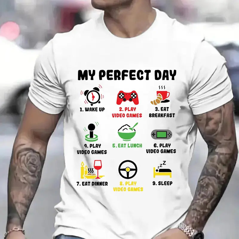 Weißes Baumwoll-T-Shirt für Herren mit einer farbenfrohen Grafik mit dem Titel „My Perfect Day“ und Symbolen, die einen täglichen Ablauf darstellen, einschließlich Aufwachen, Videospiele spielen, Mahlzeiten einnehmen und Schlafen.