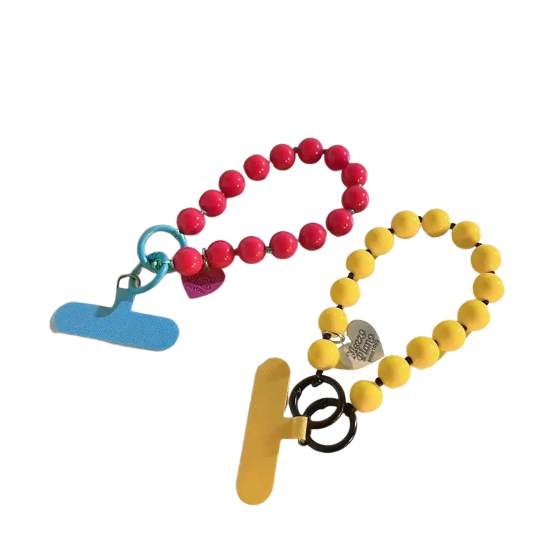 Front view of vibrant pink and yellow beaded phone strap with heart-shaped charms and plastic toggle clasp