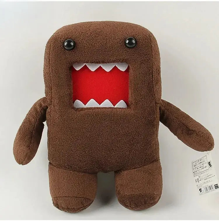 Peluche brune Domo kun de 20 cm, animal en peluche avec des yeux à boutons noirs et une bouche rouge bordée de dents triangulaires blanches.
