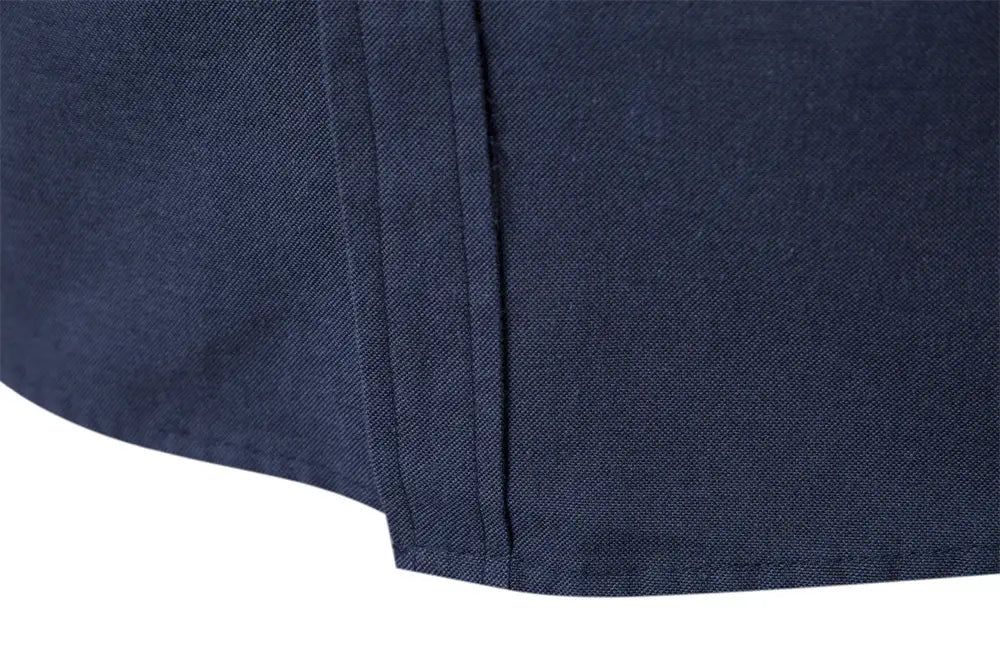 Navy blue woven fabric with subtle texture and clean straight seam detail on a dress shirt with contrast collar long sleeve design for fashion social shirts.