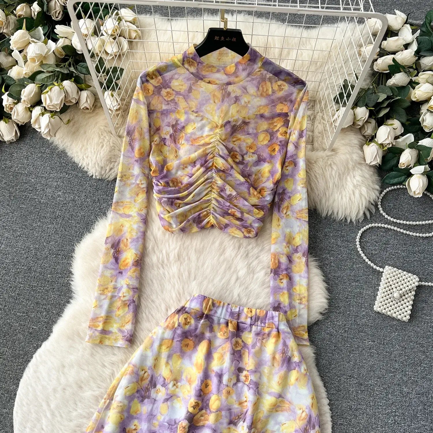 purple and yellow floral print long-sleeved top with ruched front detail featured in a two piece mesh skirt set with marble print and elastic closure type