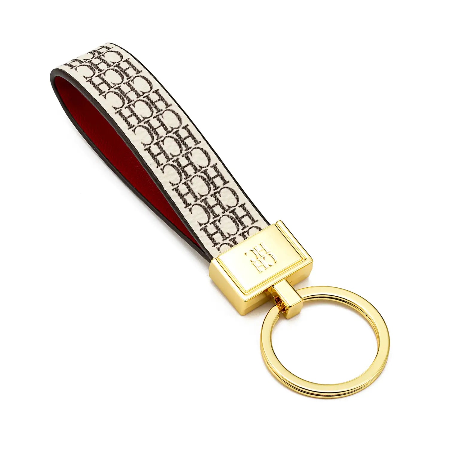 Leather logo keychain designer fashion accessory featuring a gold-toned key ring with a cream-colored strap displaying a repeating black hch monogram pattern and red interior lining.