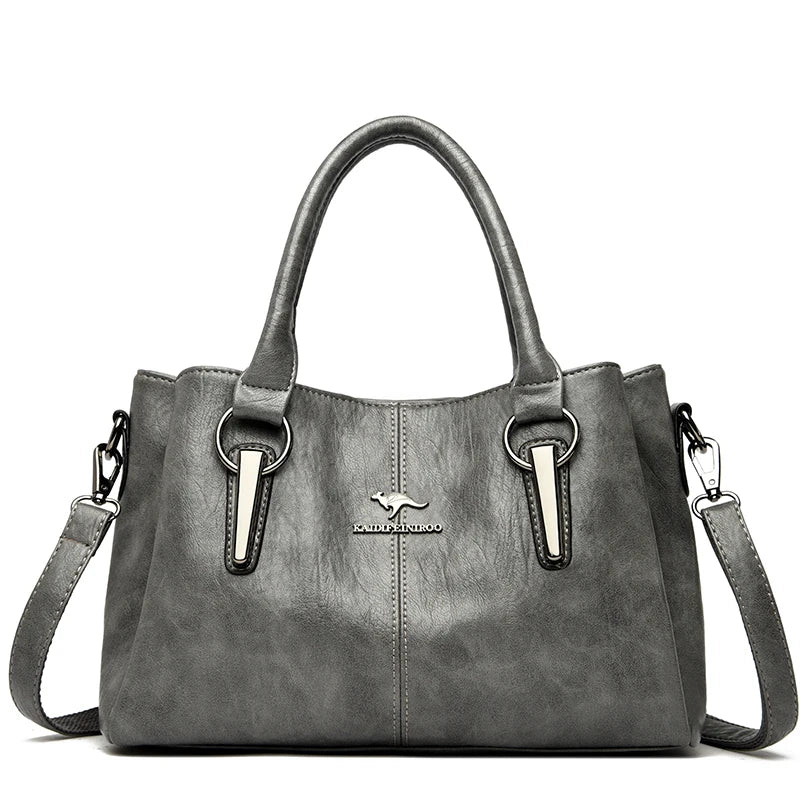 Gray kangaroo leather crossbody handbag with textured faux leather silver-toned accents and pocket interior design