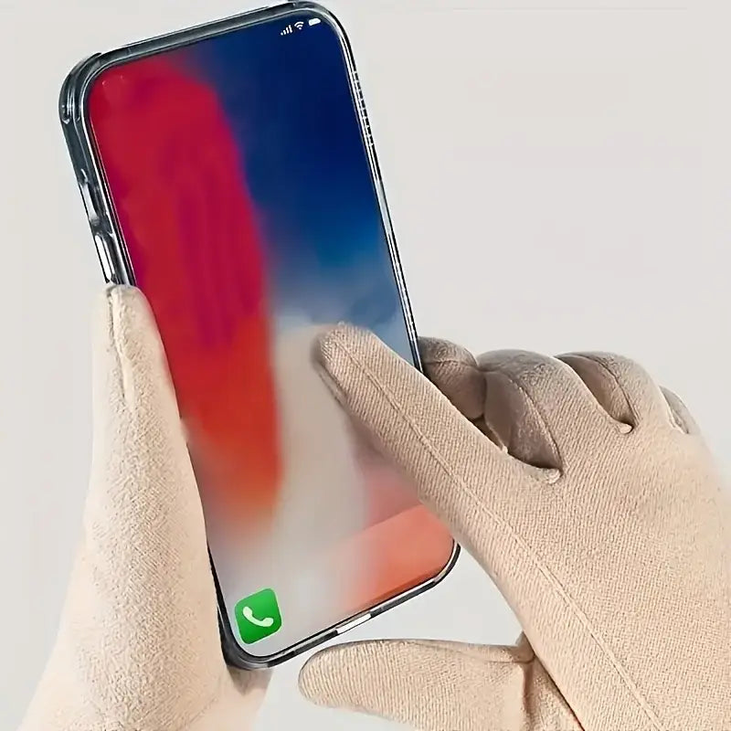 A sleek black iPhone X with a vibrant red and blue gradient screen encased in a transparent protective cover displayed with women winter touchscreen gloves fleece lined windproof.