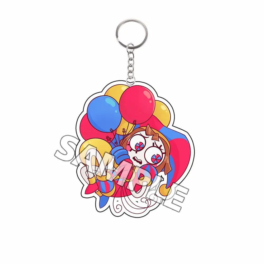 Llavero acrílico colorido que presenta al personaje caricaturesco Tadc de ojos grandes, que lleva un sombrero de bufón y sostiene globos rojos, azules y amarillos, como producto terminado.