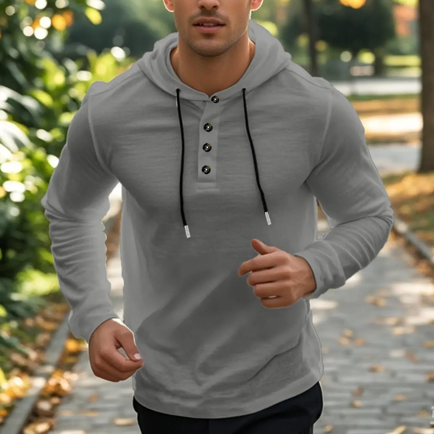 Men cotton linen hooded henley shirt in gray with long sleeves, black drawstrings, and button details.