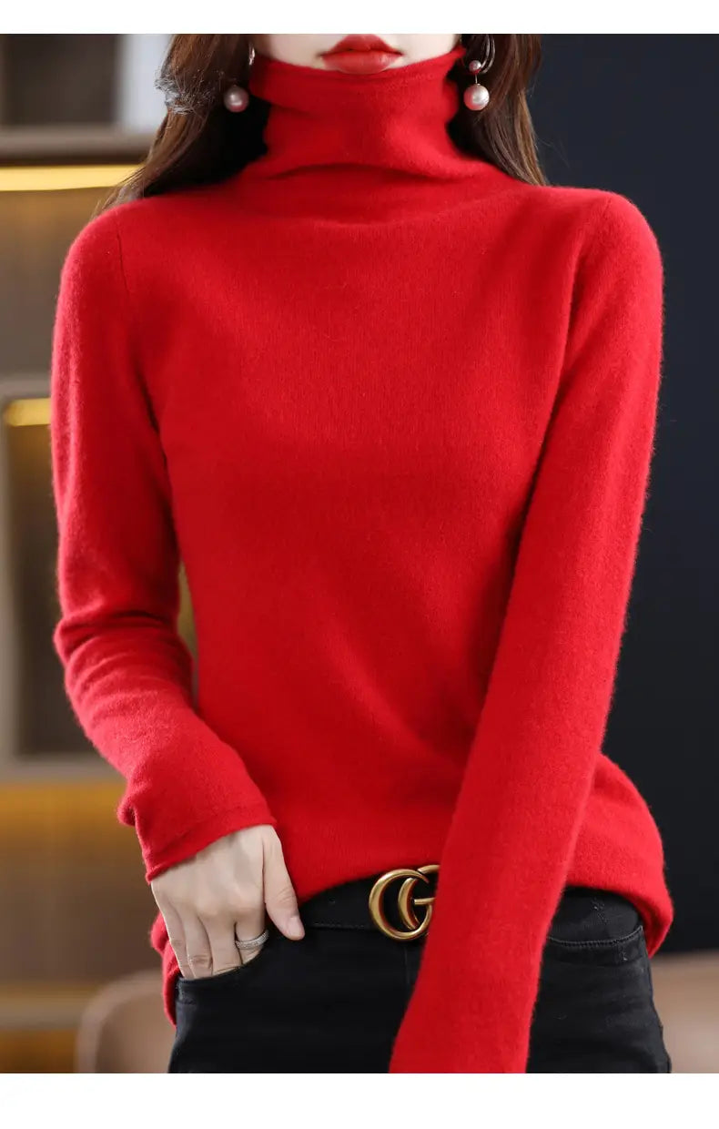 A vibrant red merino wool turtleneck sweater for women featuring a soft knit texture and long sleeves.