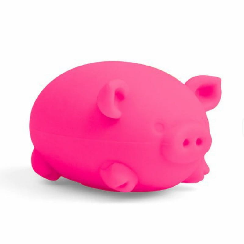 a bright pink plush pig-shaped needoh digging pig sensory fidget toy with rounded ears and a soft squishy texture designed as a fidget toy