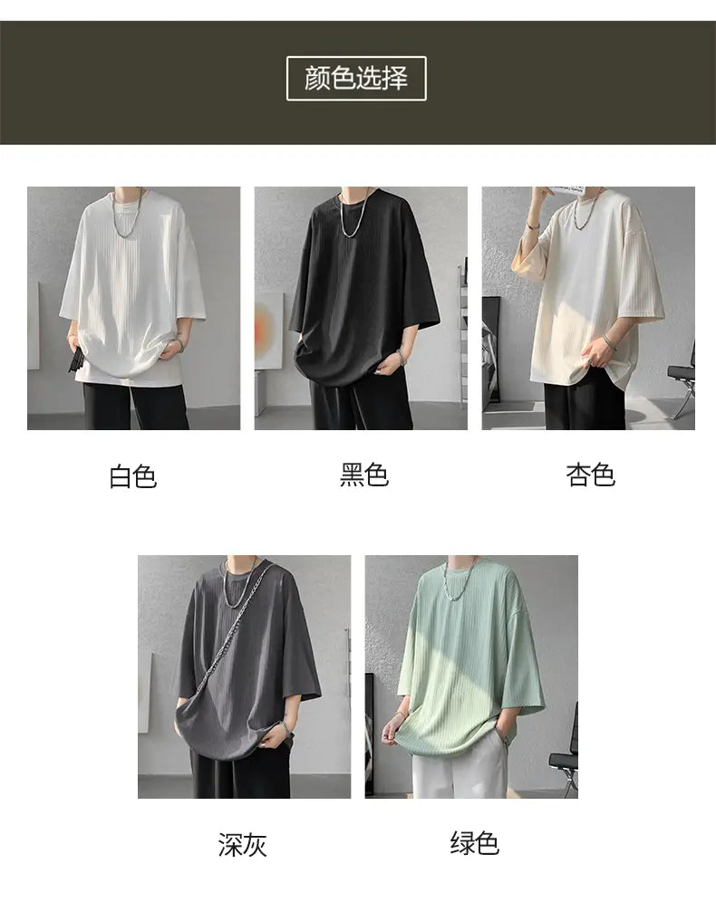 A loose-fitting men striped oversized summer t-shirt with short sleeves available in white black beige dark gray and green.