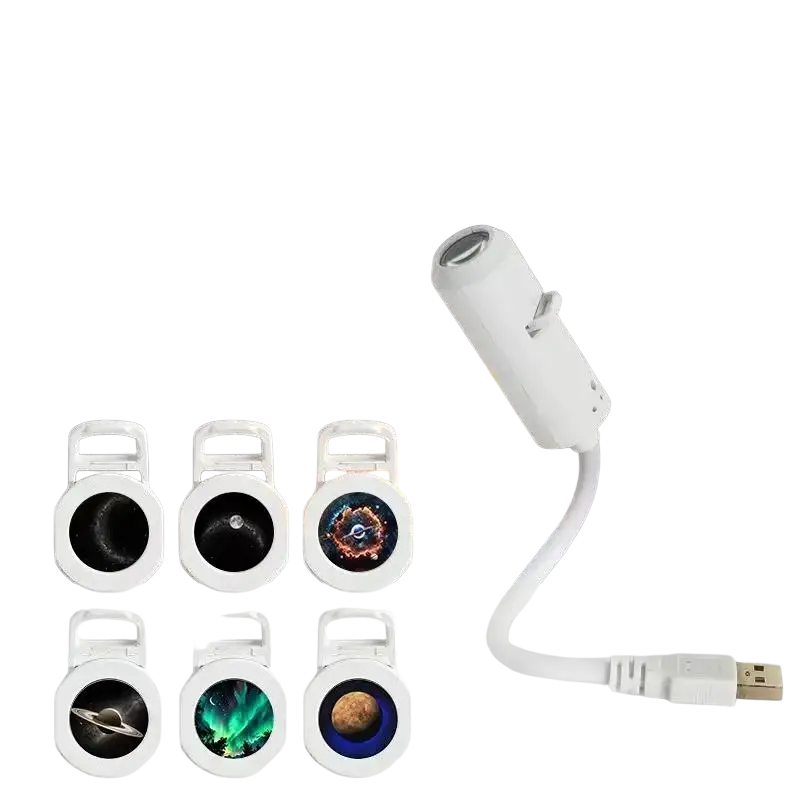 White 6-in-1 ceiling projector with usb cable and interchangeable film discs showing six cosmic night light patterns
