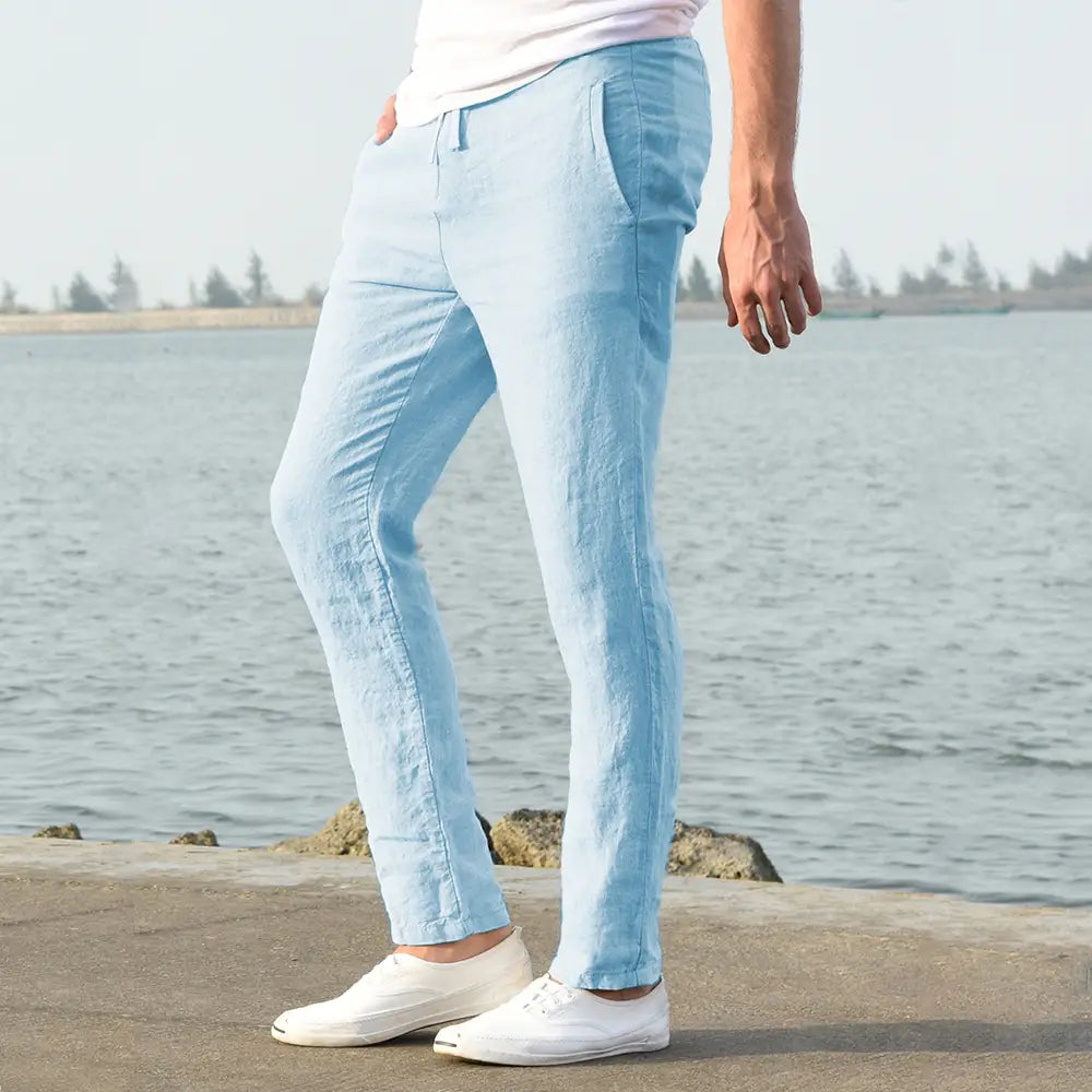 Light blue men cotton linen trousers with a relaxed fit and subtle texture designed as breathable casual pants.