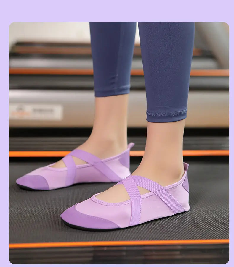 Light purple women yoga shoes with soft flexible fabric upper and matching elastic straps designed as anti-slip fitness flats.