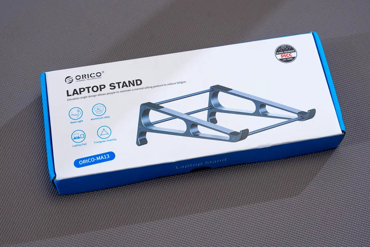 Orico portable aluminum laptop stand in silver with sleek minimalist design and triangular stability for desktop riser use.